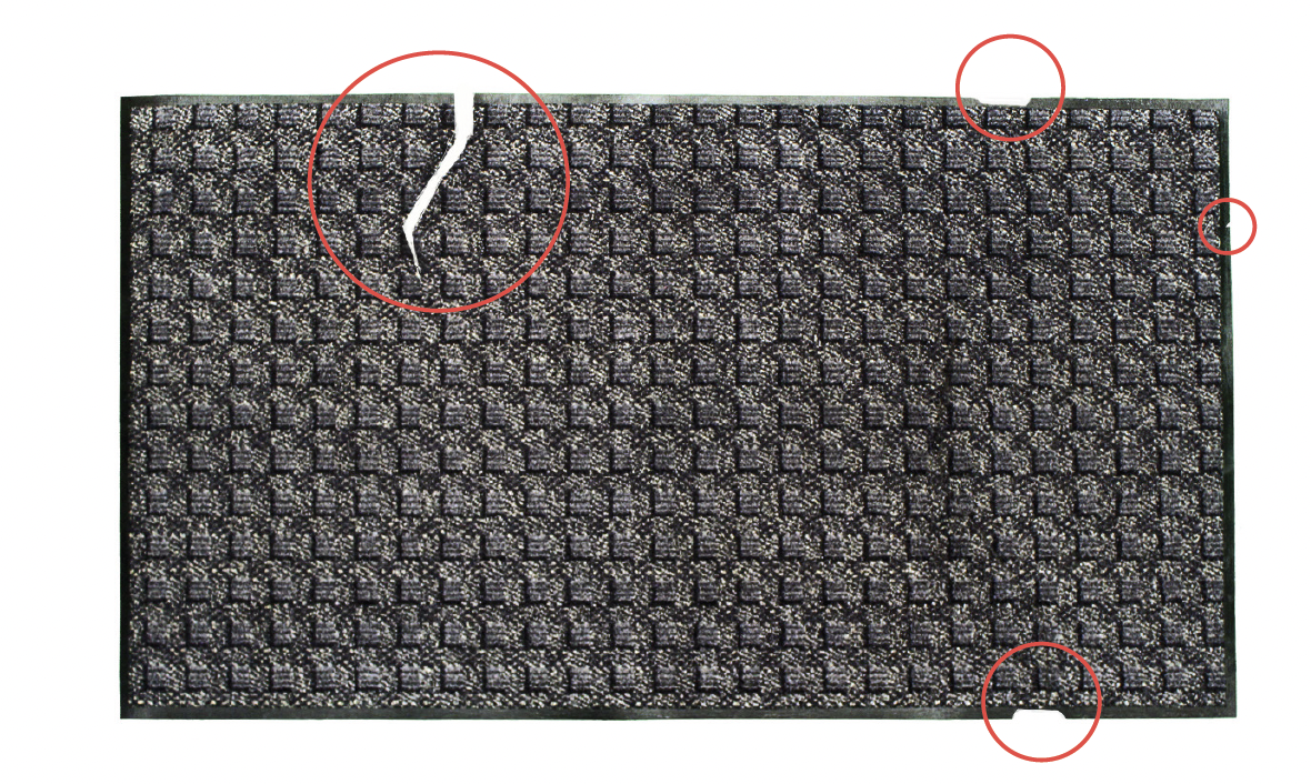 Damaged SteadyStep mat with repairable tears and edge damage